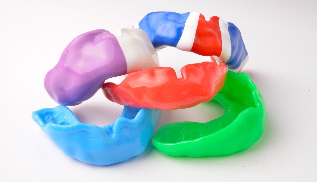 Selection of custom sports mouthguards in assorted colours