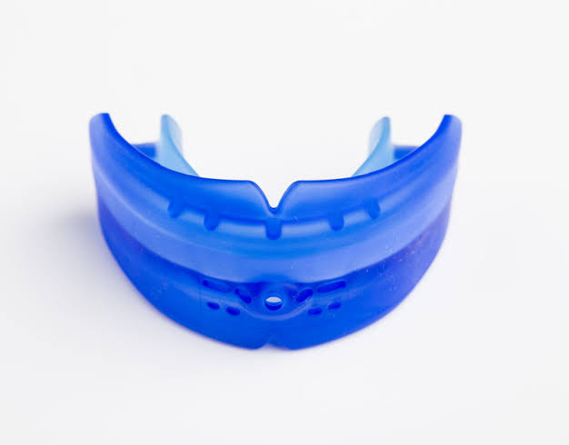 Custom-made blue sports mouthguard, moulded for comfort and protection